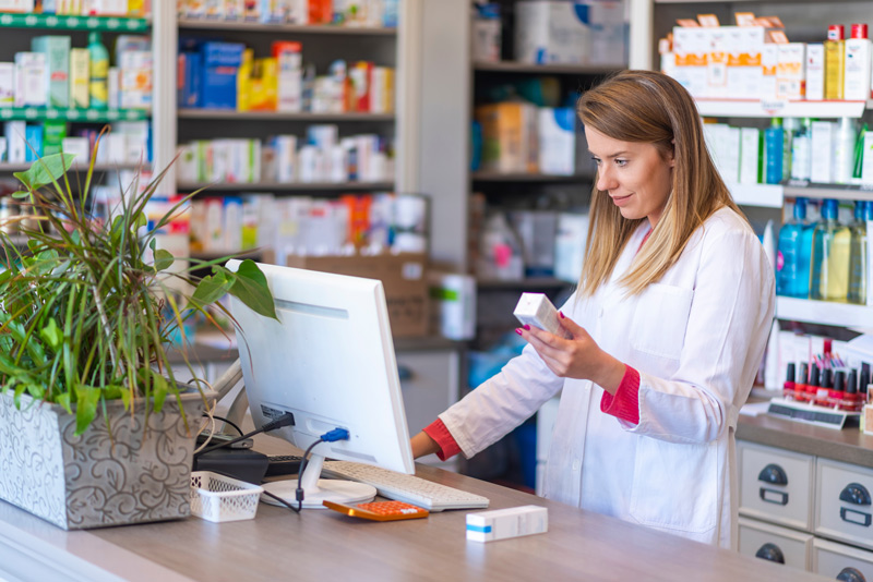 POSitec-Solutions-Partner-Pharmacist-using-point-of-sale-system